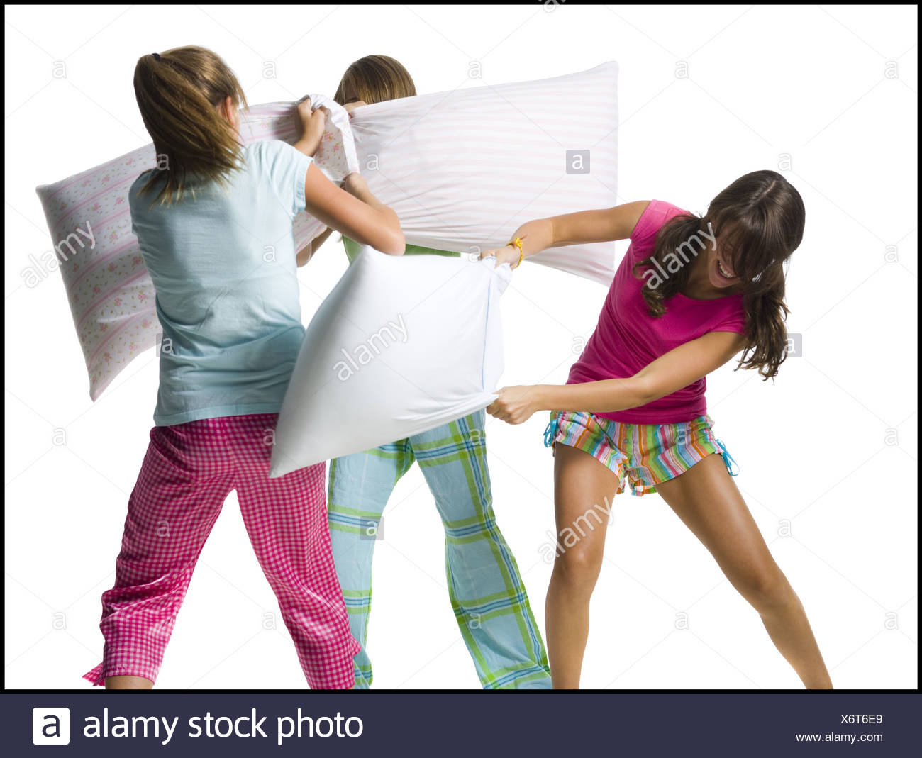 Three Girls Pillow Fighting Stock Photo 279585777 Alamy