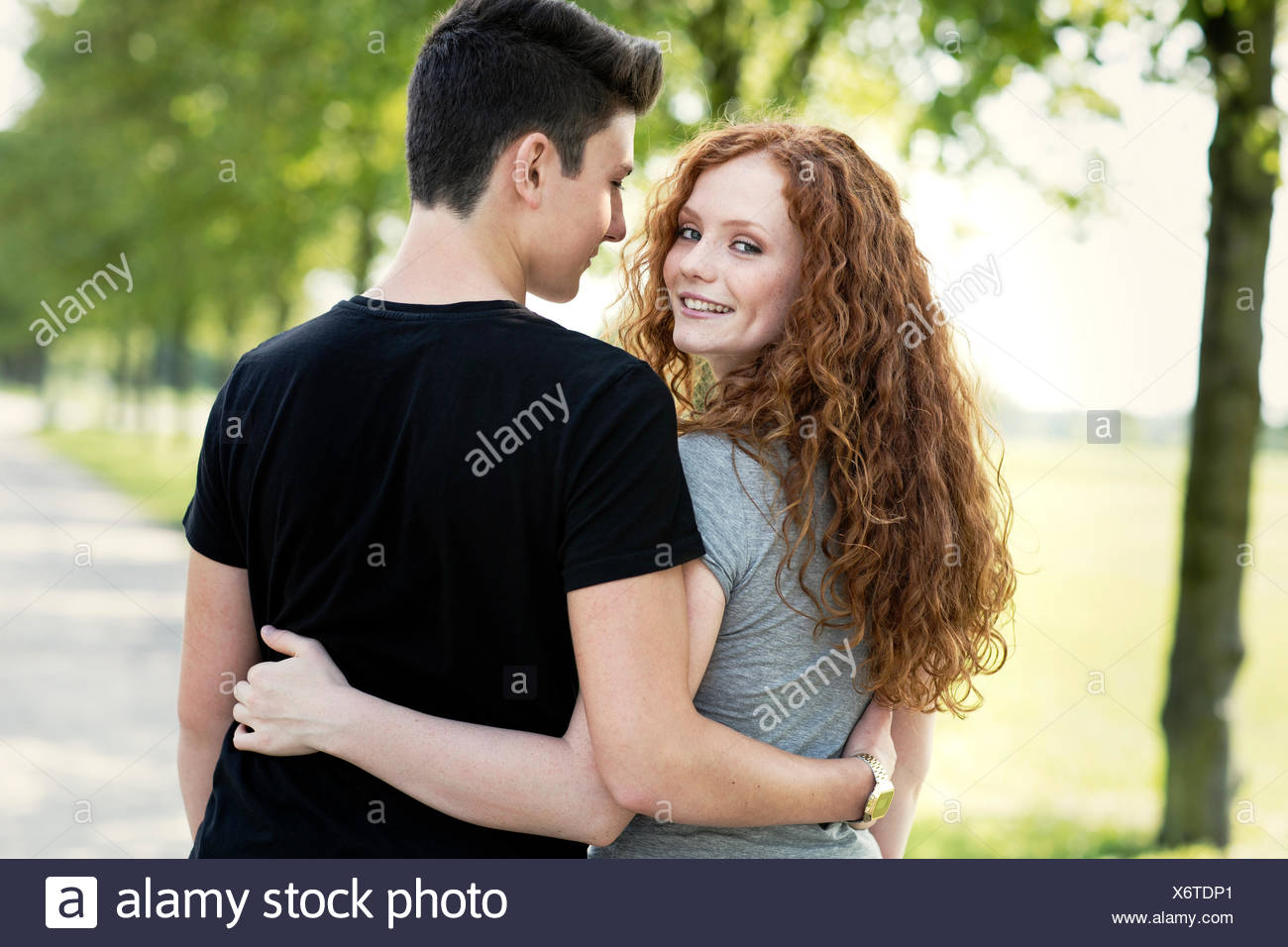 Teenage Couple In Love Arm In Arm Stock Photo Alamy