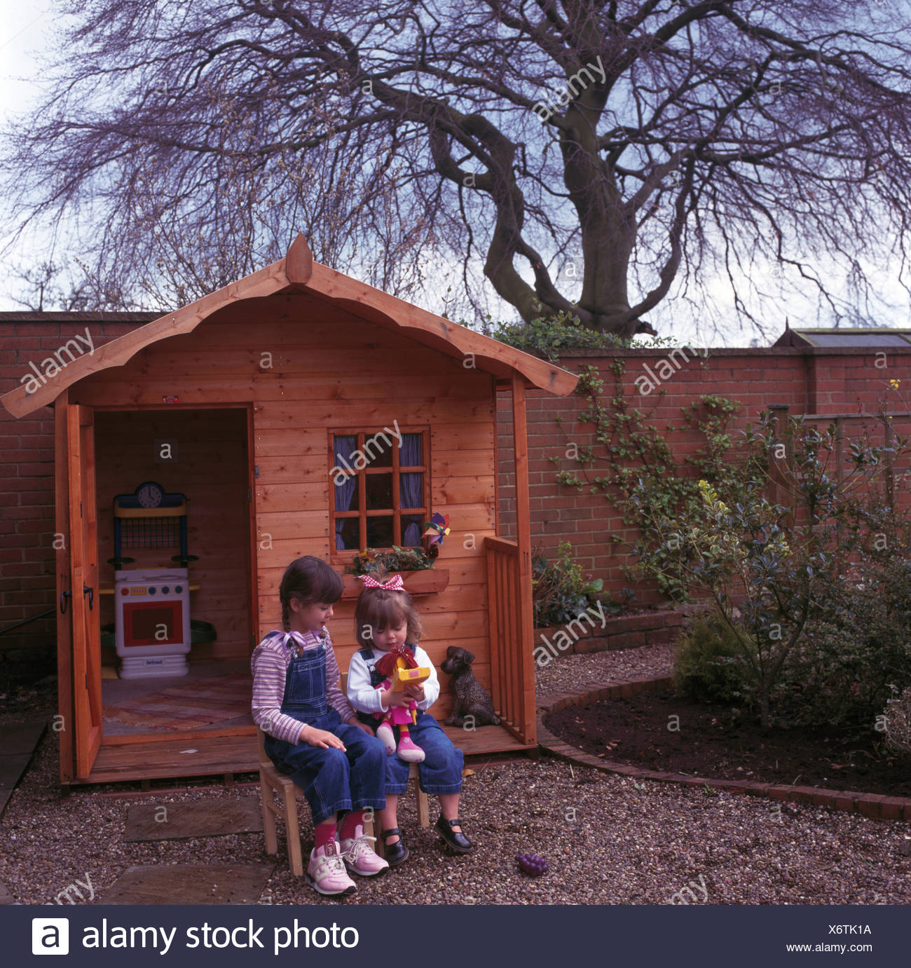 girls outside playhouse