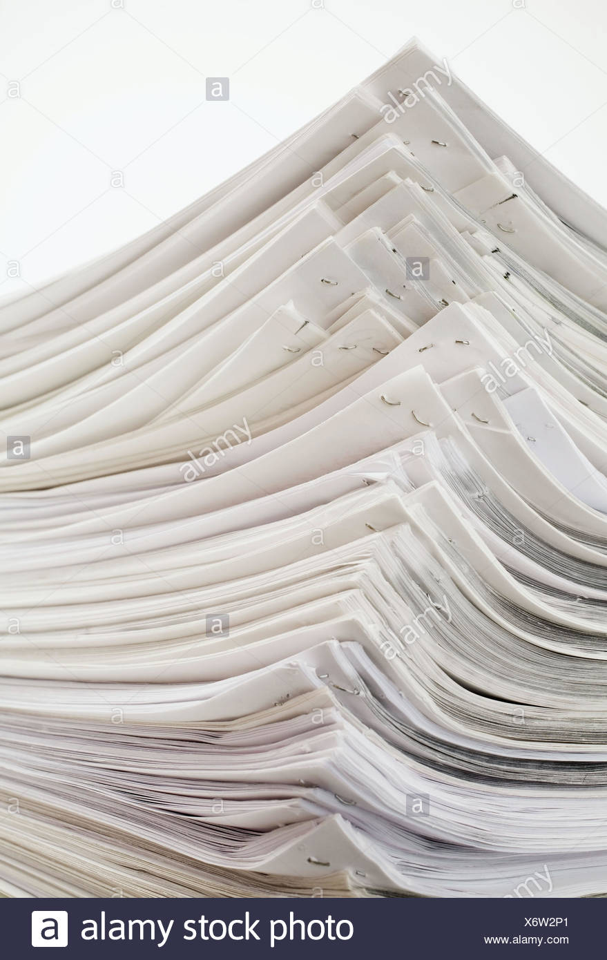 Stack Of Stapled White Sheets Of Office Paper On A White