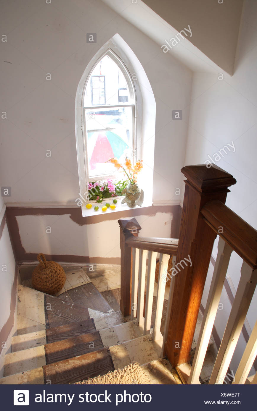 View From Top Of Stairs With Wooden Banisters Down Staircase Below