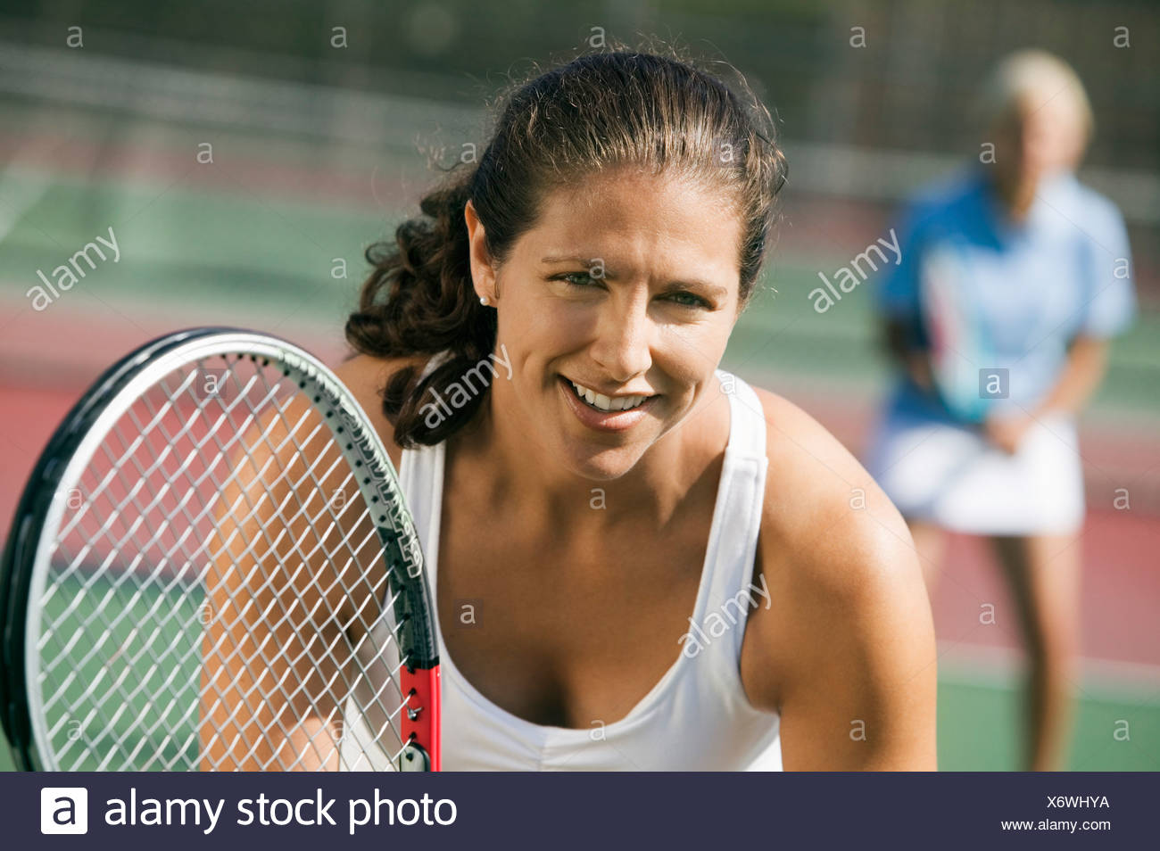 Female Doubles Tennis Players Waiting For Serve Focus On Foreground Close Up Stock Photo Alamy