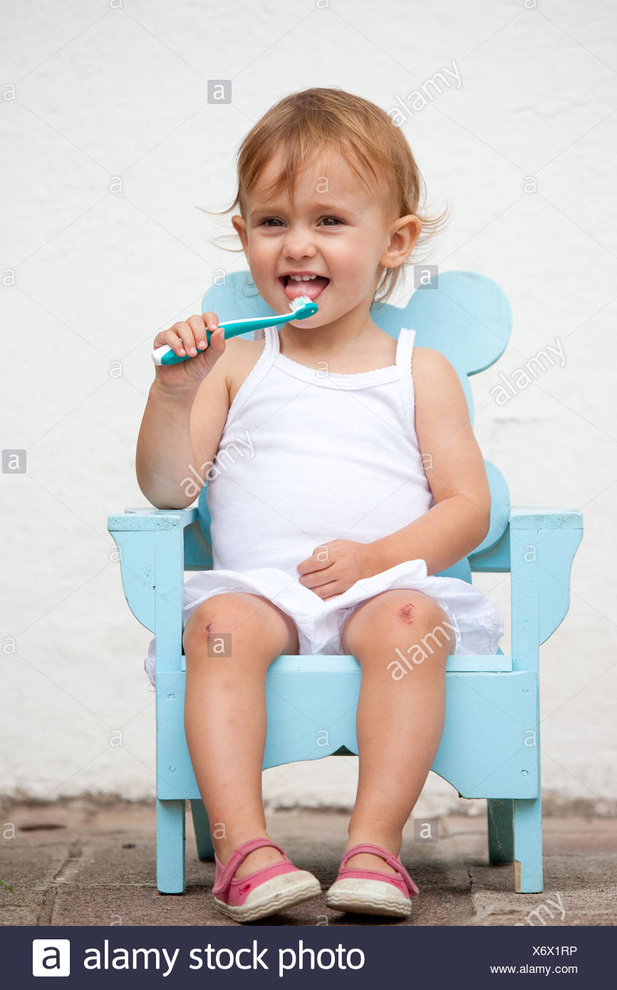 Month Old Baby Girl Brushing Her Teeth Stock Photo Alamy