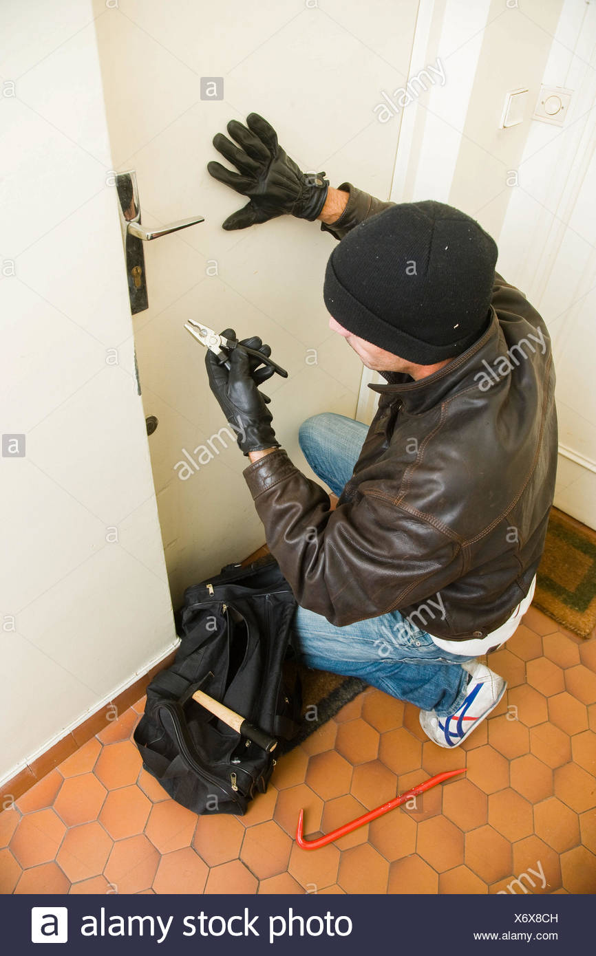 Burglar Trying To Pry Open Door Stock Photo 279631201 Alamy