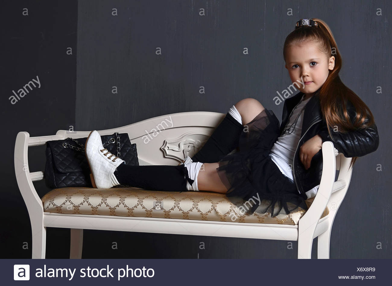 beautiful young female child model wearing a black Stock ...