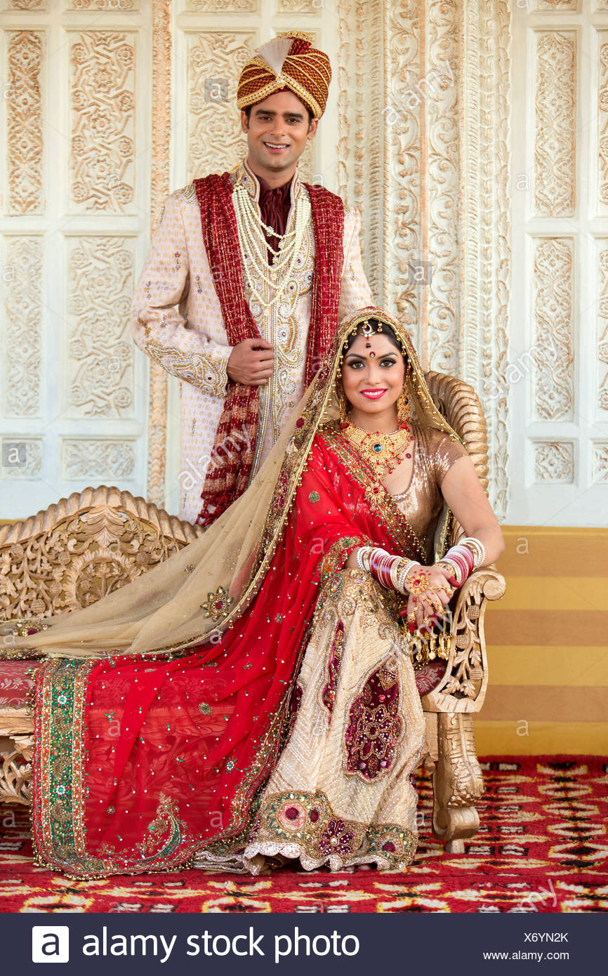 Indian Bride And Groom In Traditional Wedding Dress Stock Photo
