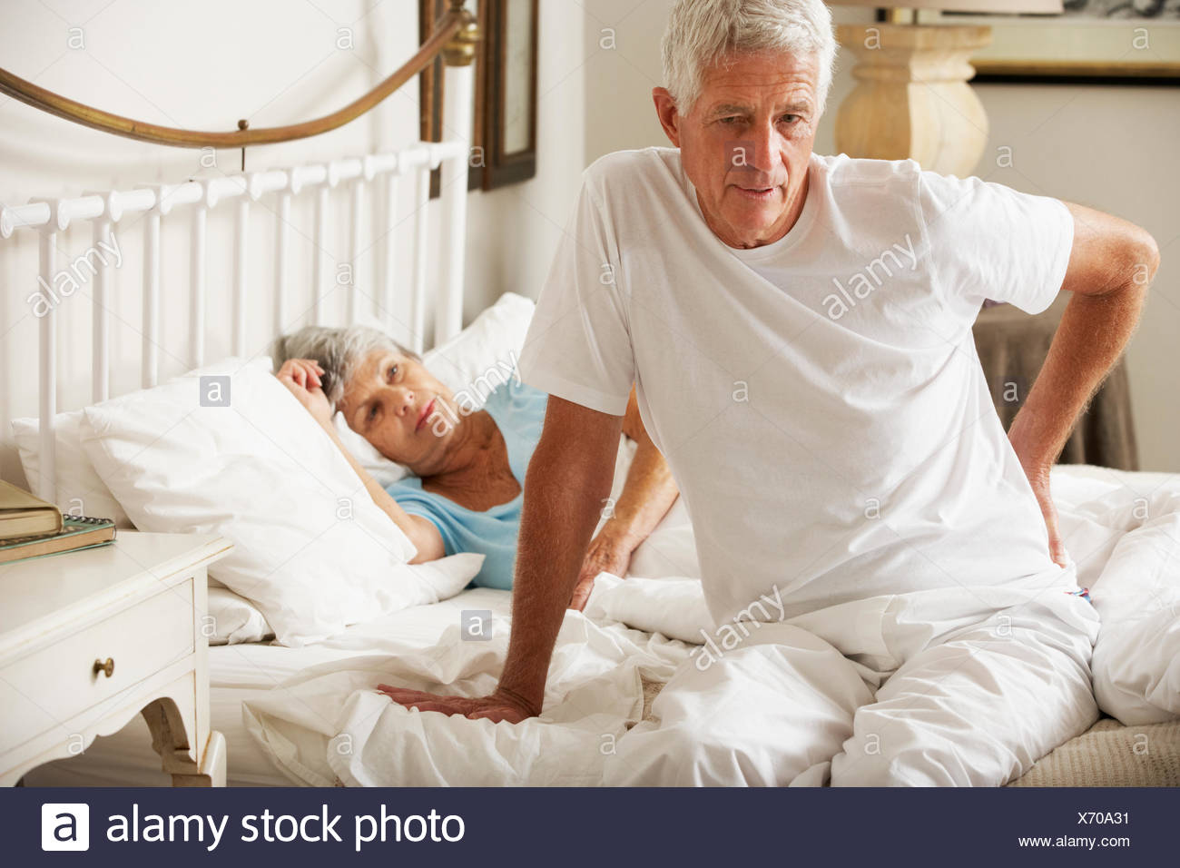 Senior Man Suffering From Backache Getting Out Of Bed Stock Photo Alamy Senior Man Suffering From Backache Getting Out Of Bed Stock Photo Alamy