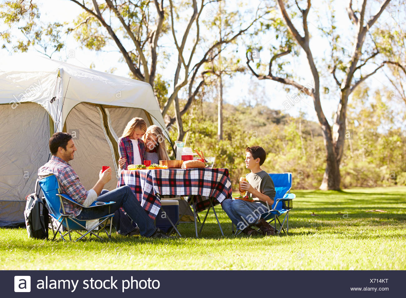 Family Enjoying Camping Holiday In Countryside Stock Photo Alamy