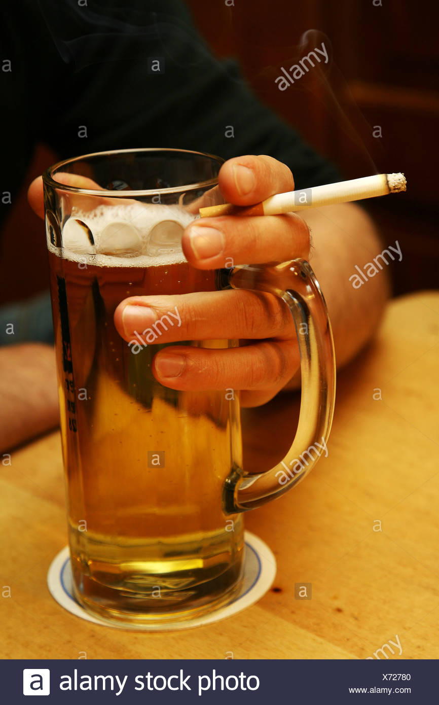 Holding Beer Cigarette Stock Photos & Holding Beer Cigarette Stock