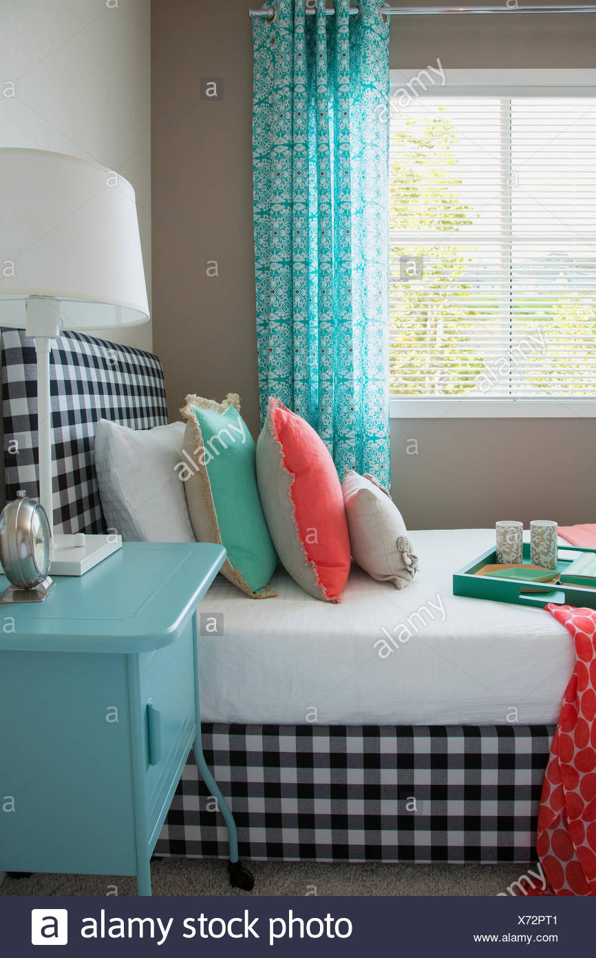 Coral And Seafoam Green Decor On Gingham Bed Stock Photo