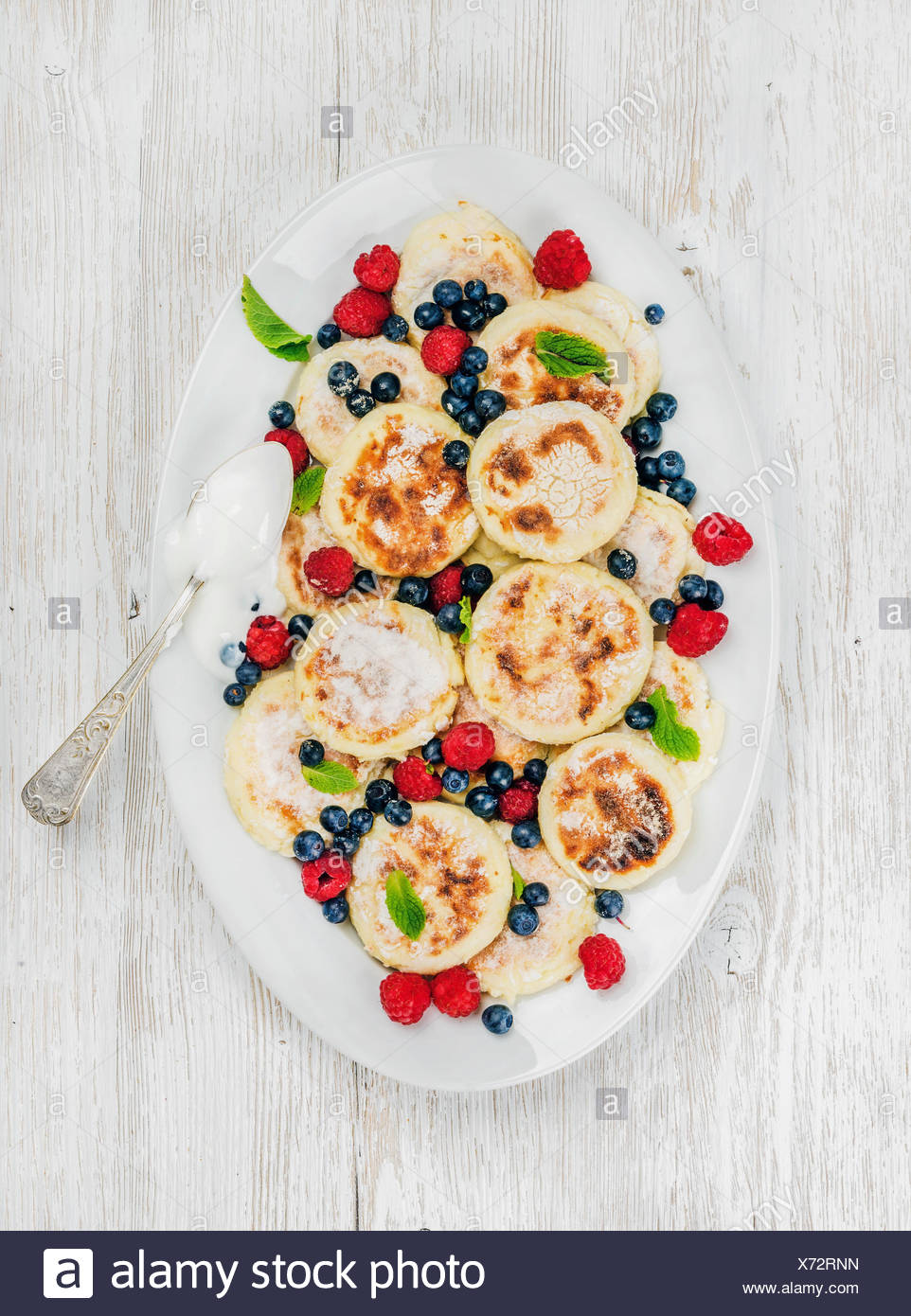 Syrniki Or Cottage Cheese Pancakes With Fresh Forest Berries And