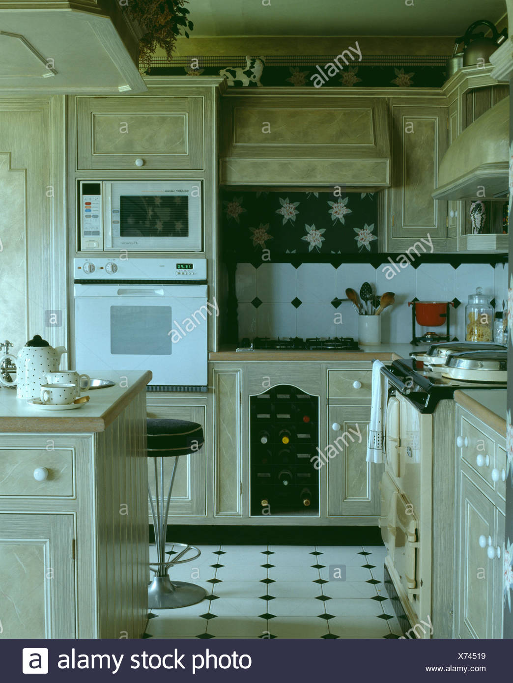 Eye Level Microwave And White Oven In Kitchen With Paint