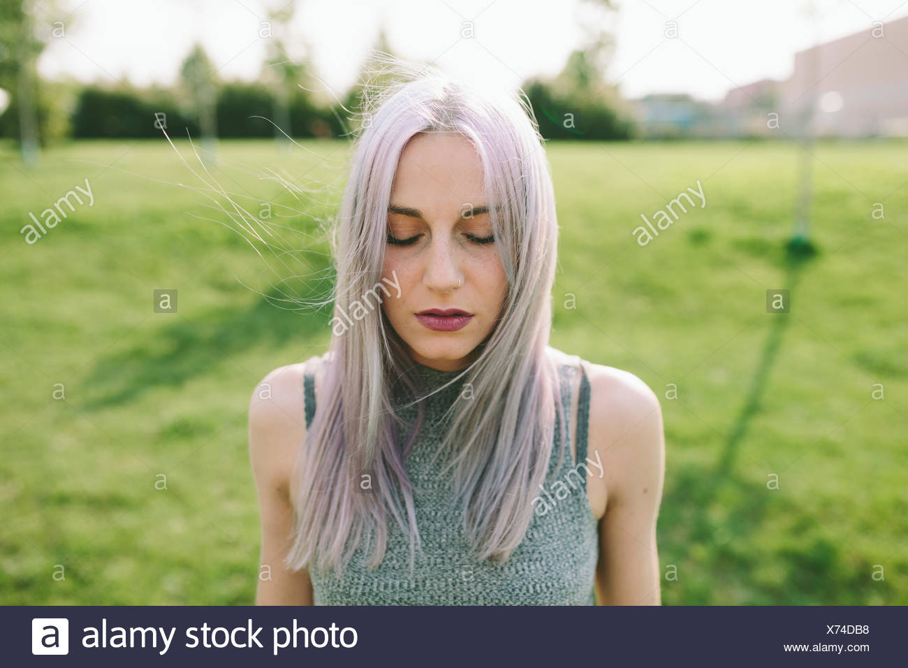 Young Woman With Pink Grey Hair On A Meadow Stock Photo