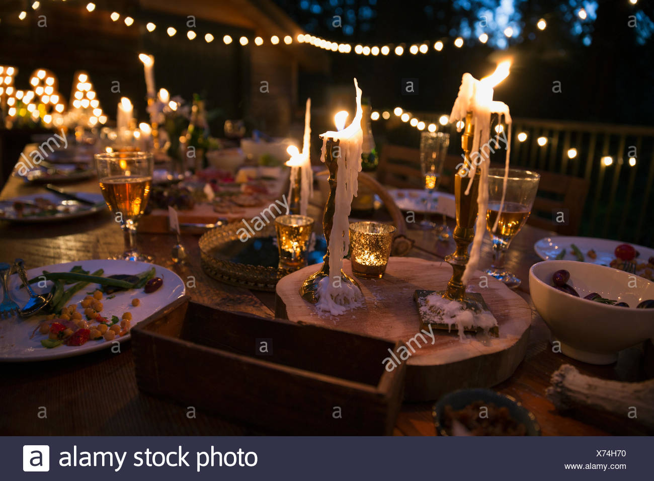 Melting Candles And Food On Wedding Reception Table Stock Photo