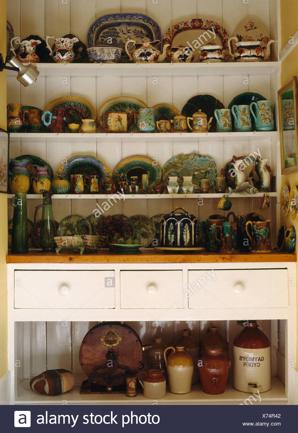 Collection Of Antique Majolica Ware On White Victorian Dresser