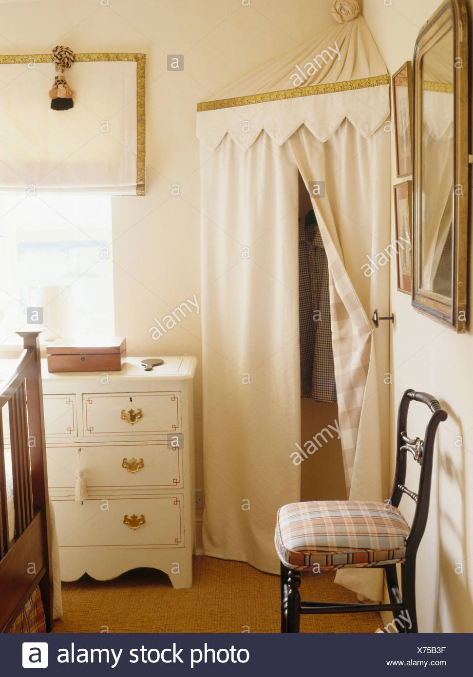 Cream Tented Storage Cupboard In Corner Of Cottage Bedroom With