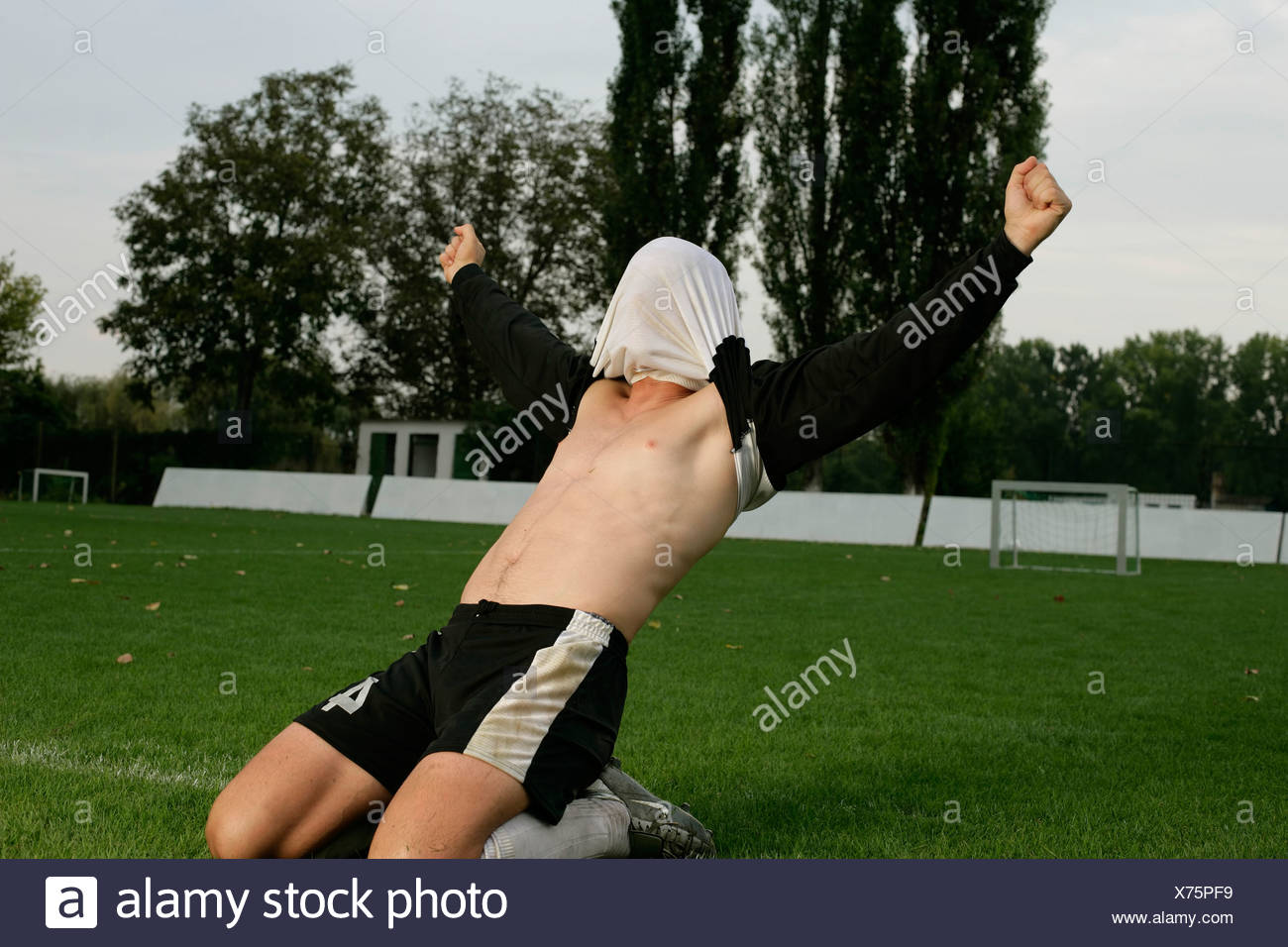 Soccer Player Shirt Over Head High Resolution Stock Photography and