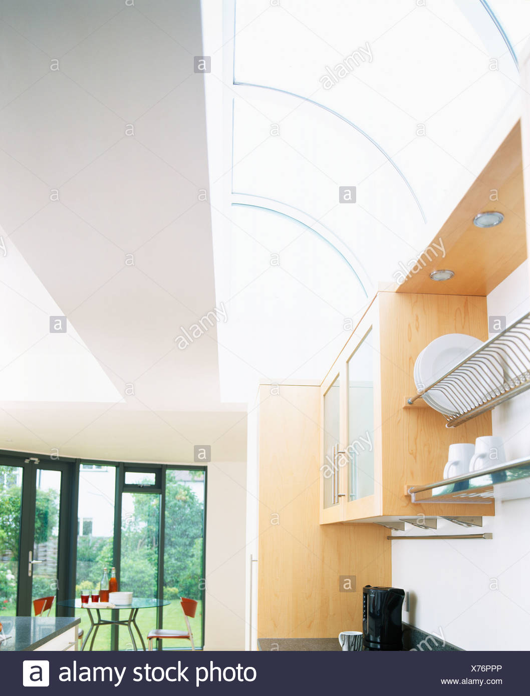 Curved Glass Ceiling In Large Modern Kitchen With View Of