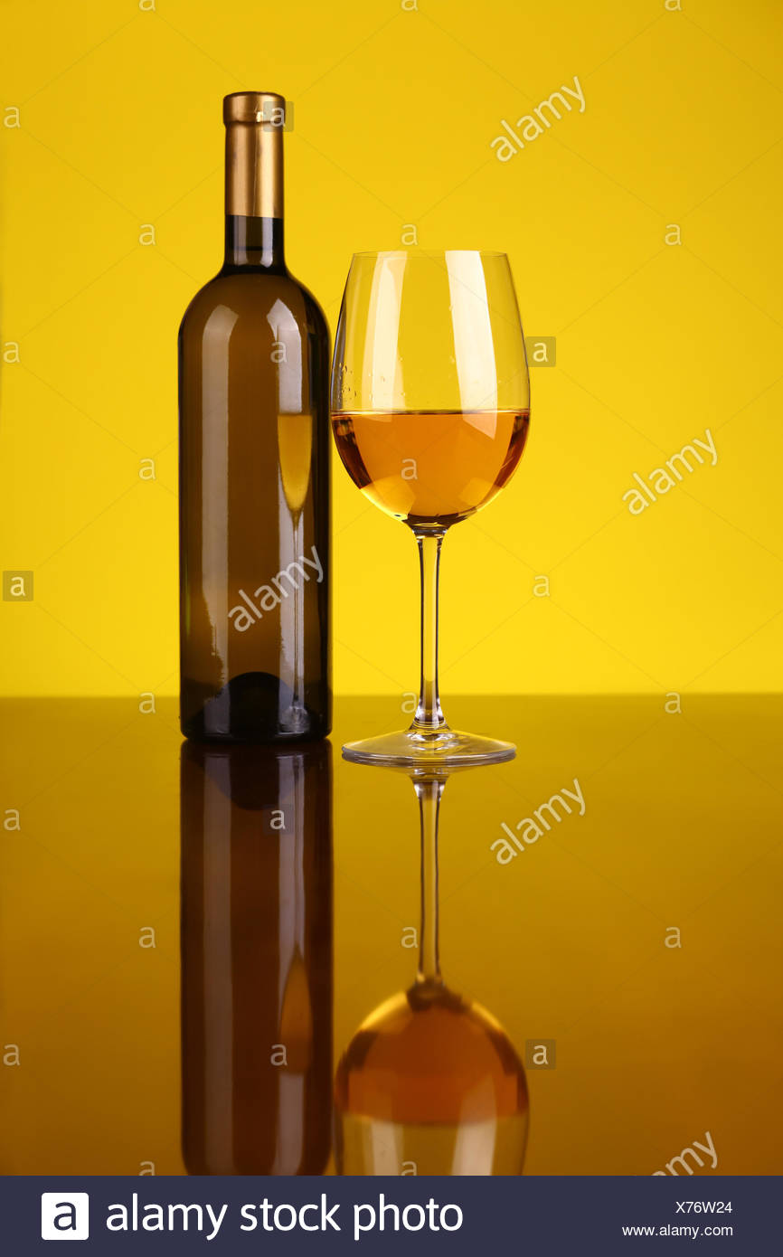 Download Glass And Bottle Of White Wine Over A Yellow Background Stock Photo Alamy Yellowimages Mockups