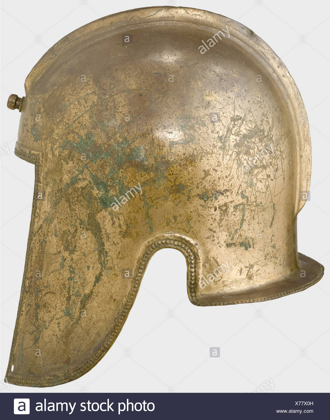 An Illyrian Bronze Helmet Southeast Europe 5th Century B C Skull Embossed In One Piece With A Helmet Crest Rail Formed Of Two Ridges Fastening Knob On The Forehead Two Small Holes At The Nape