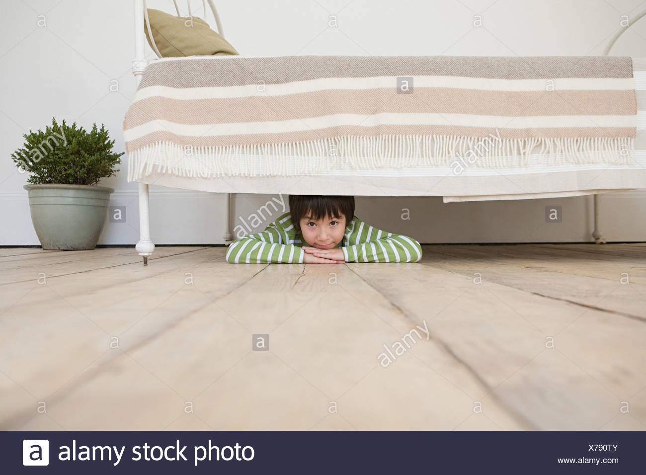 Boy Hiding Under Bed High Resolution Stock Photography and Images Alamy