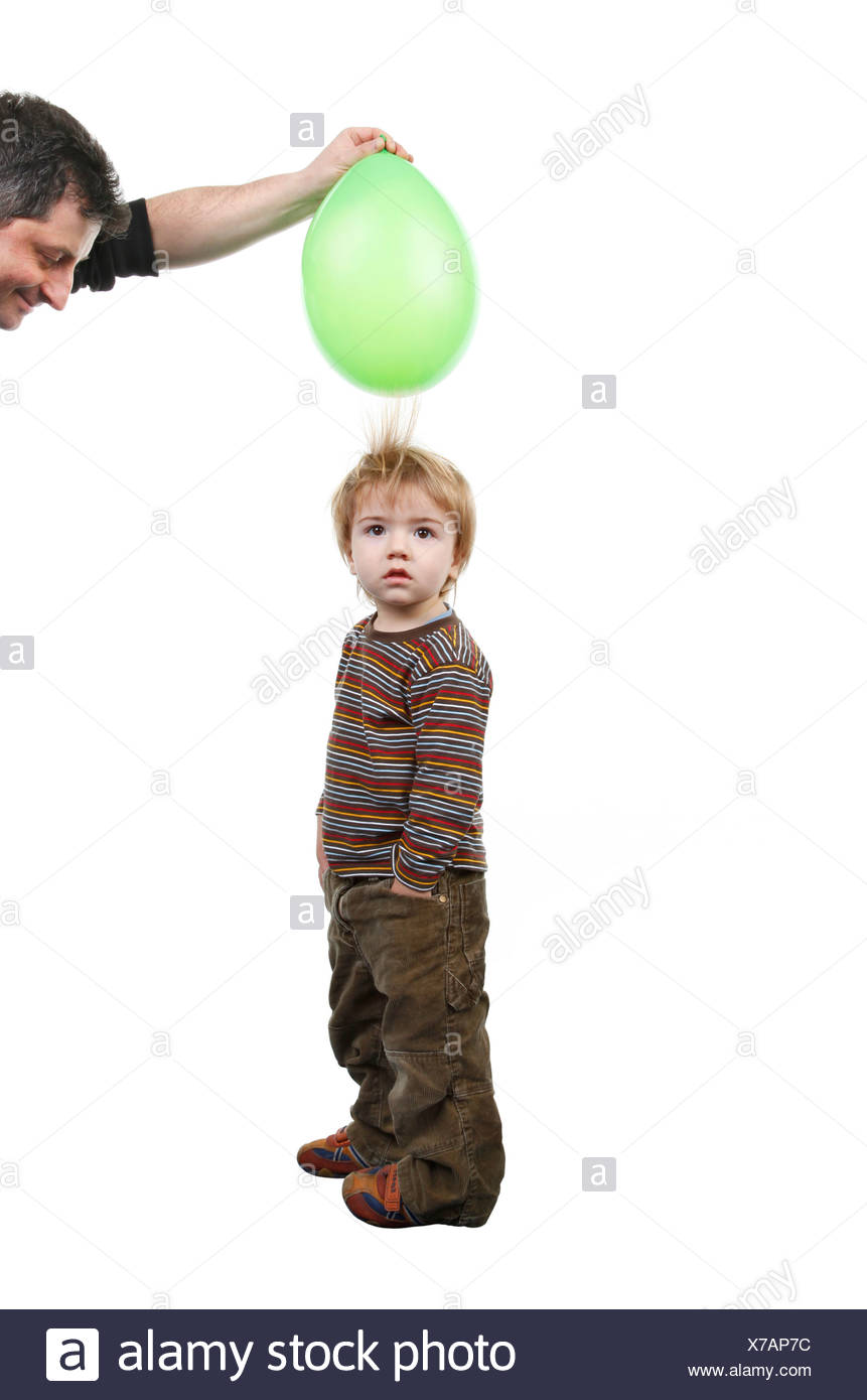 Little Boy S Hair Being Attracted By An Air Balloon Charged With