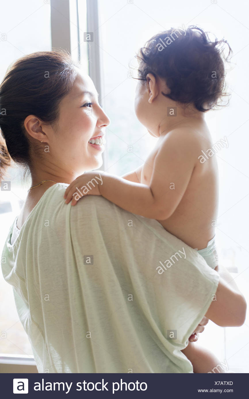 Woman Holding Baby Rear View Stock Photos & Woman Holding Baby Rear