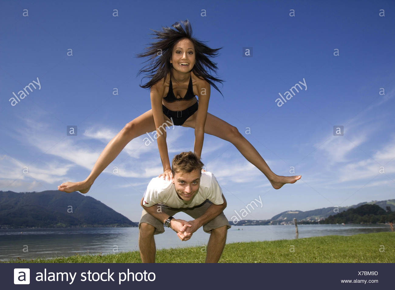 Young Woman Jumping Over Man Austria Traunsee Stock Photo Alamy Young Woman Jumping Over Man Austria Traunsee Stock Photo Alamy