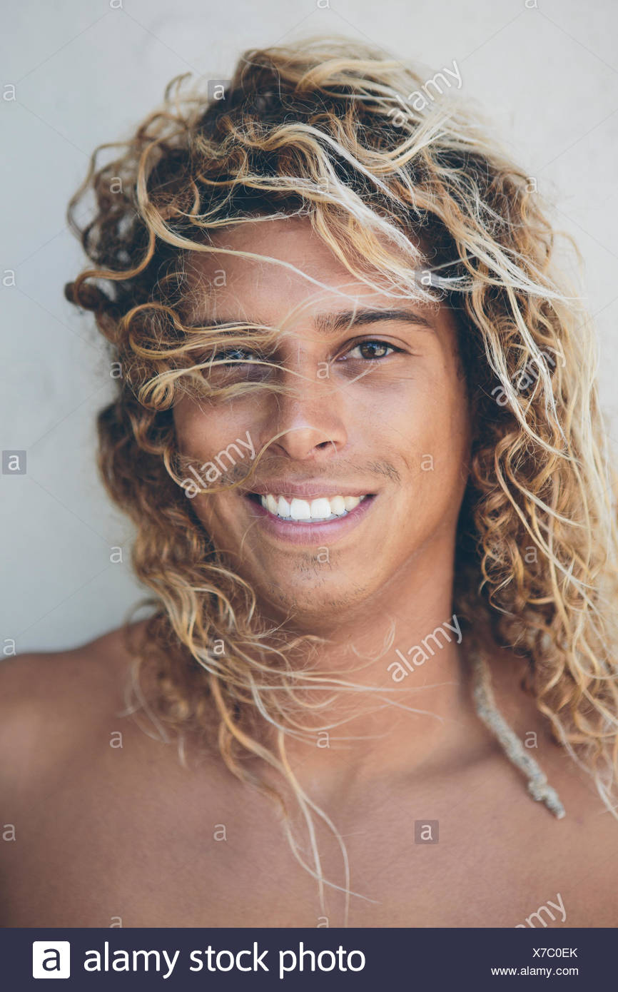Portrait Of Young Hispanic Surfer With Bleached Blonde Hair Stock