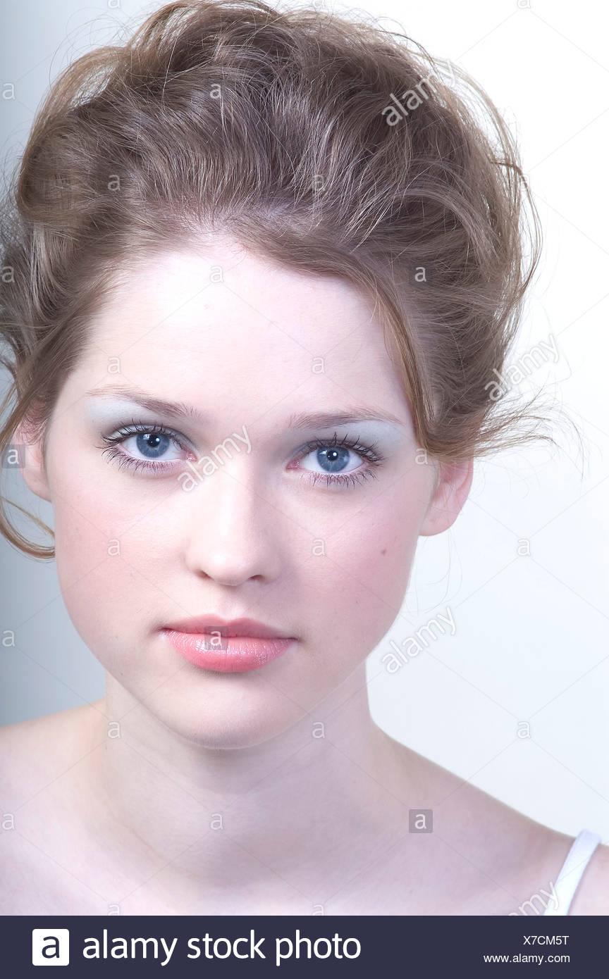 Female With Brunette Hair Worn Up Pale Blue Eye Shadow And Pale