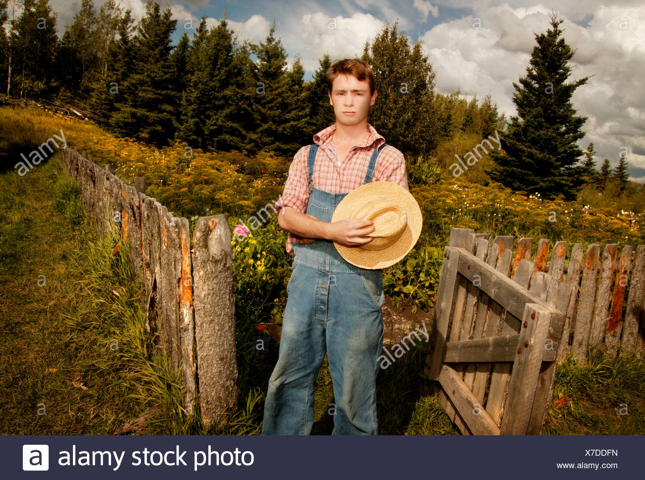 Boy in overalls with cowboy hat Stock Photo: 279964489 - Alamy