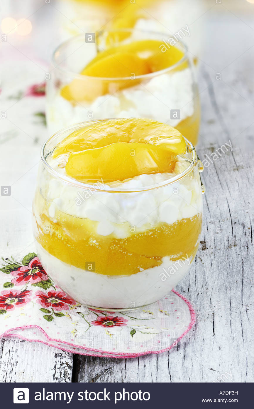 Cottage Cheese With Fresh Peaches And Honey On A Rustic Background