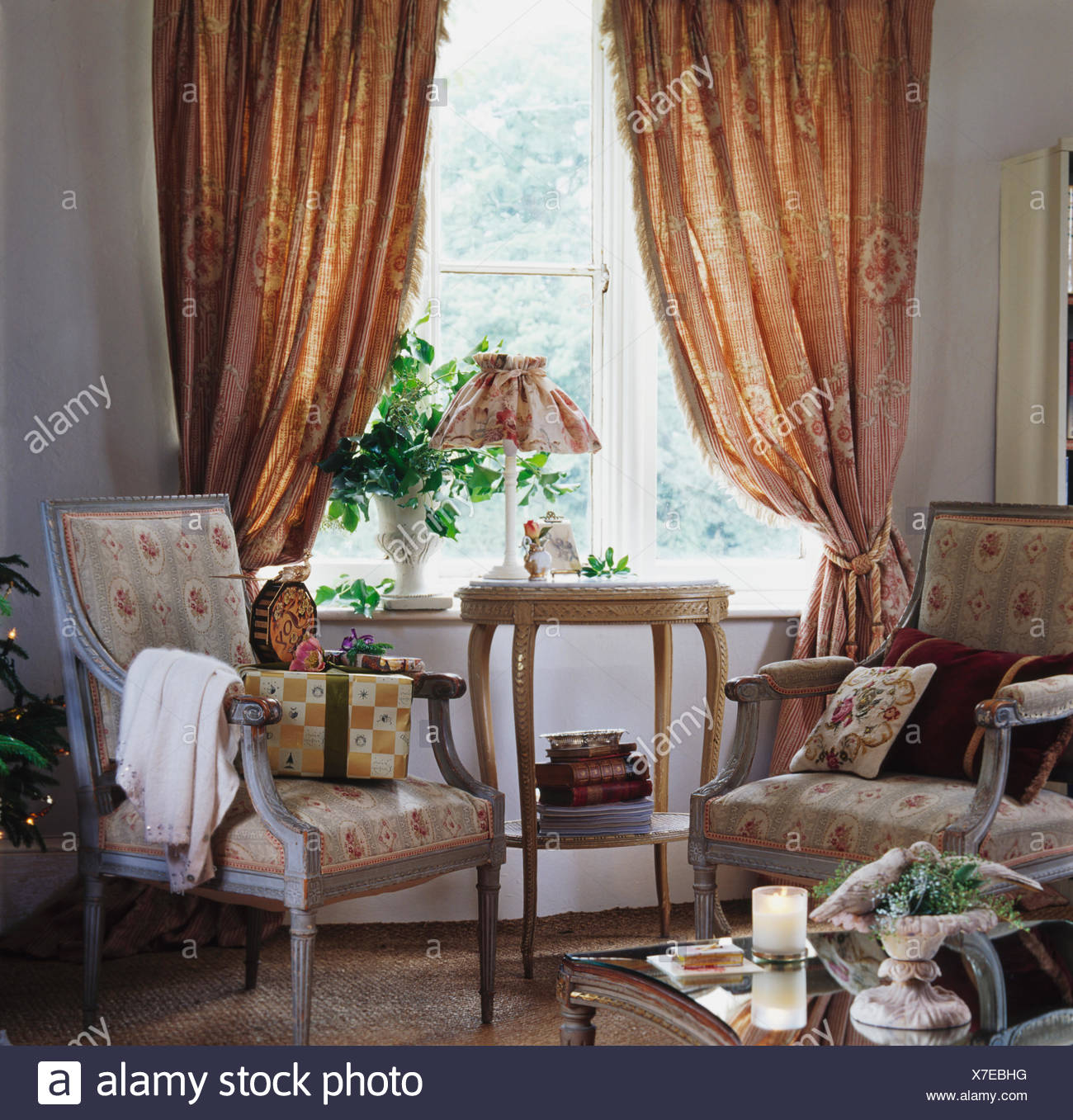 Floral Armchairs In Front Of Window With Patterned Heavy Beige Curtains In Country Living Room Stock Photo Alamy