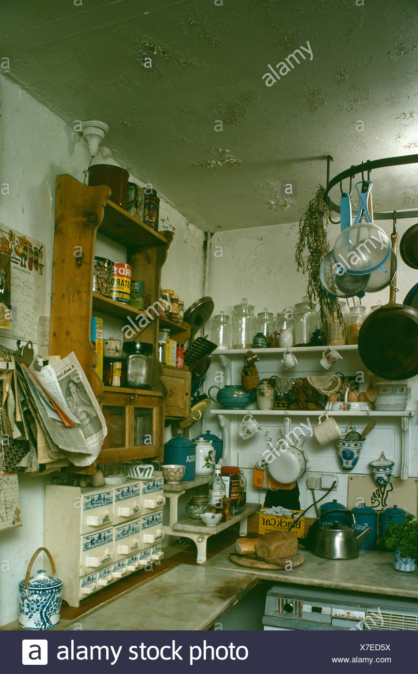 Pine Wall Shelves In Cluttered Old Fashioned Basement Kitchen With
