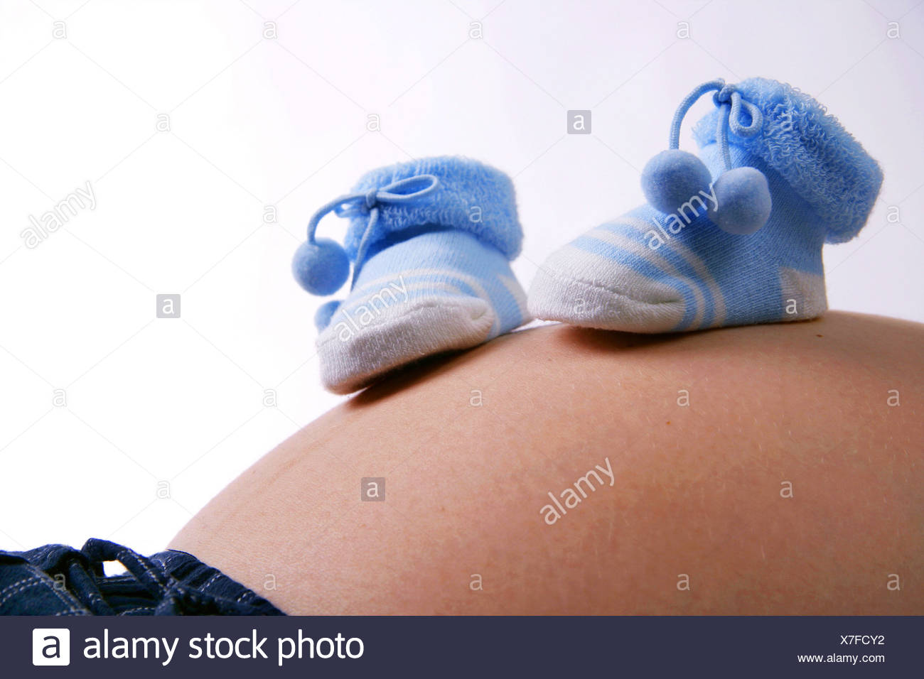 Byby Shoes On Pregnant Belly Stock Photo Alamy