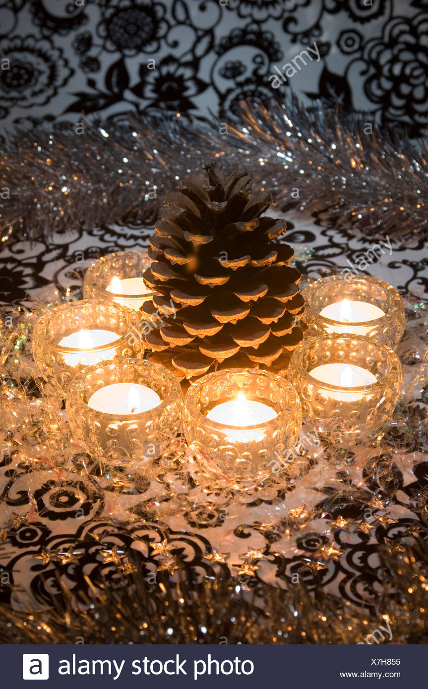 A Still Life Of A Christmas Table Decoration A Large Pine Cone