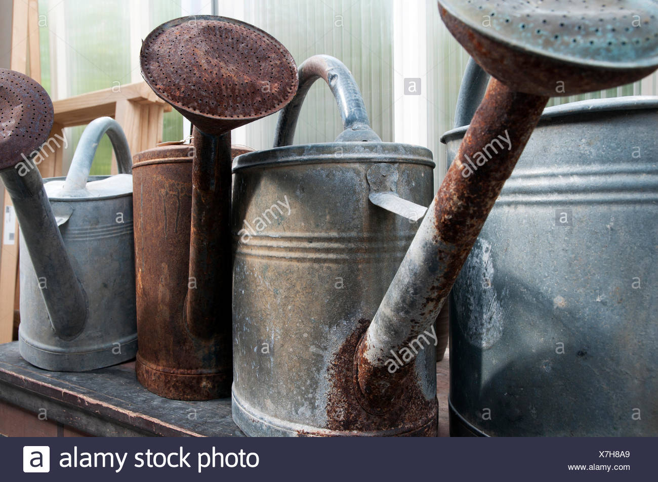 Old Metal Watering Cans Stock Photos & Old Metal Watering Cans Stock