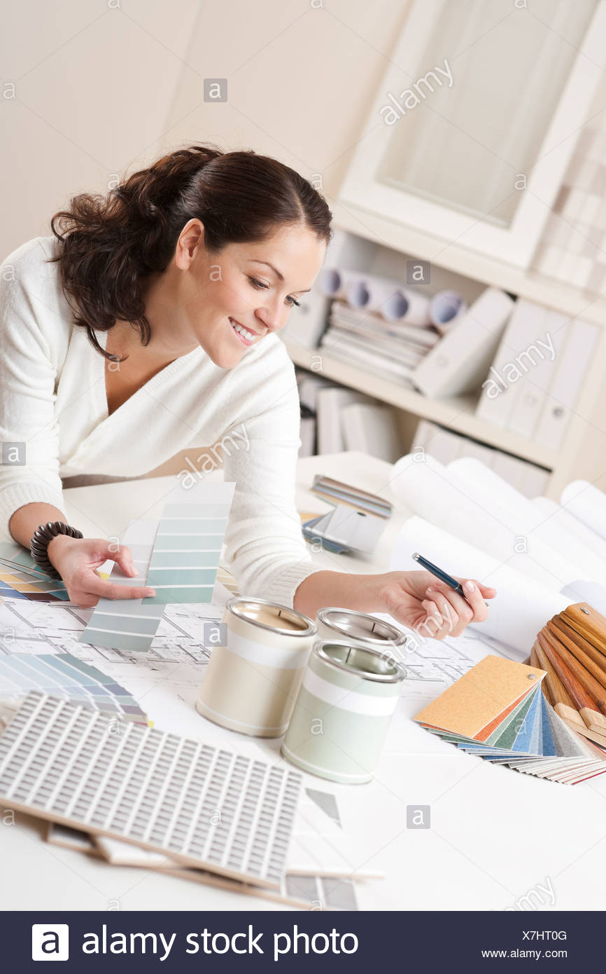 Female Interior Designer Working At Office Stock Photo