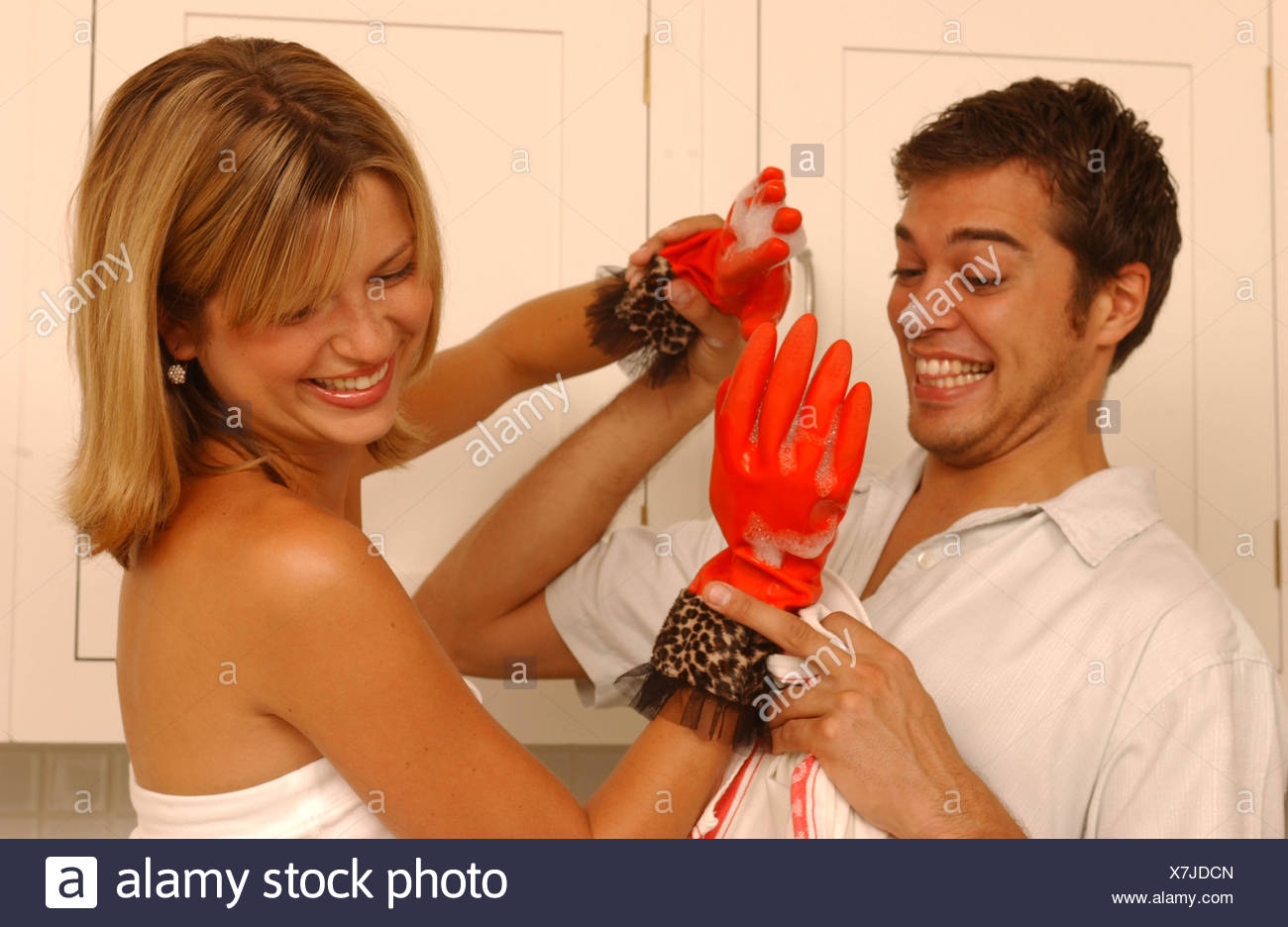 Couple In Kitchen Male Short Wavy Dark Hair Wearing White Short