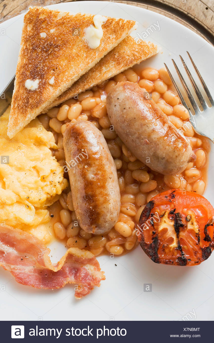 Baked Beans With Scrambled Egg Sausages Bacon Tomato Toast Stock Photo Alamy