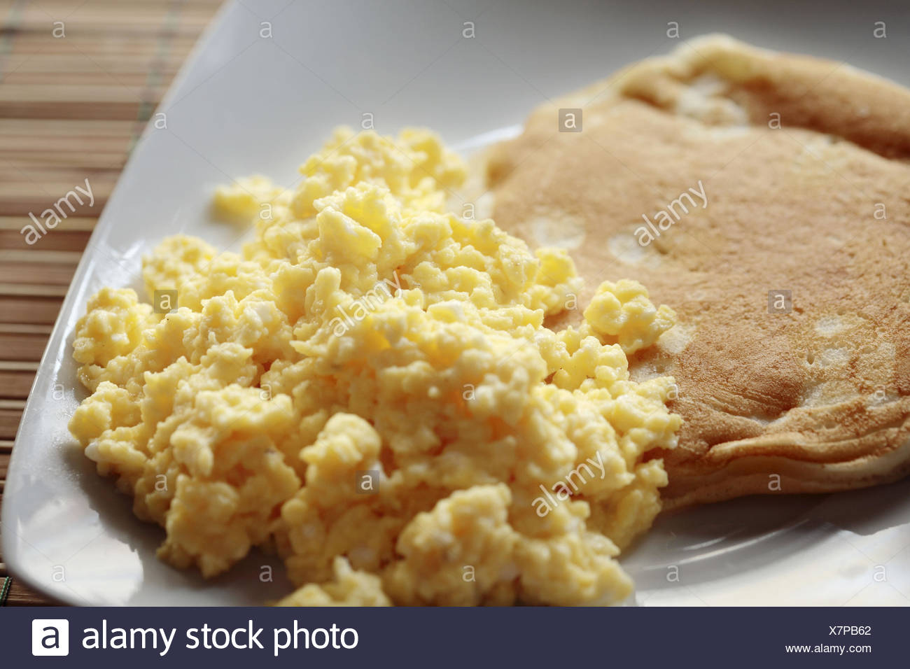 Scrambled Eggs With Pancakes Stock Photo Alamy