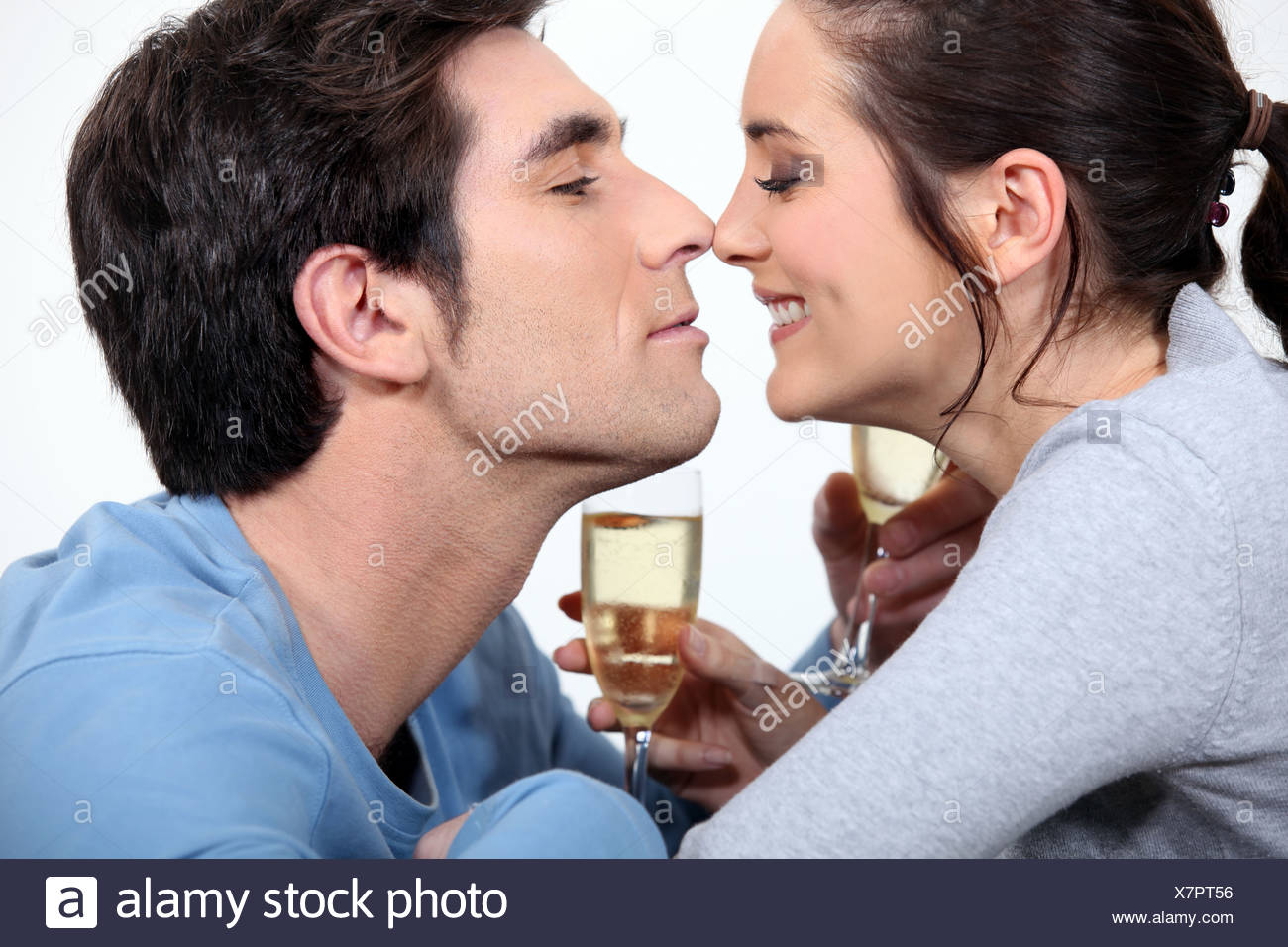 Couple With Flute Of Champagne Canoodling Stock Photo Alamy Couple With Flute Of Champagne Canoodling Stock Photo Alamy