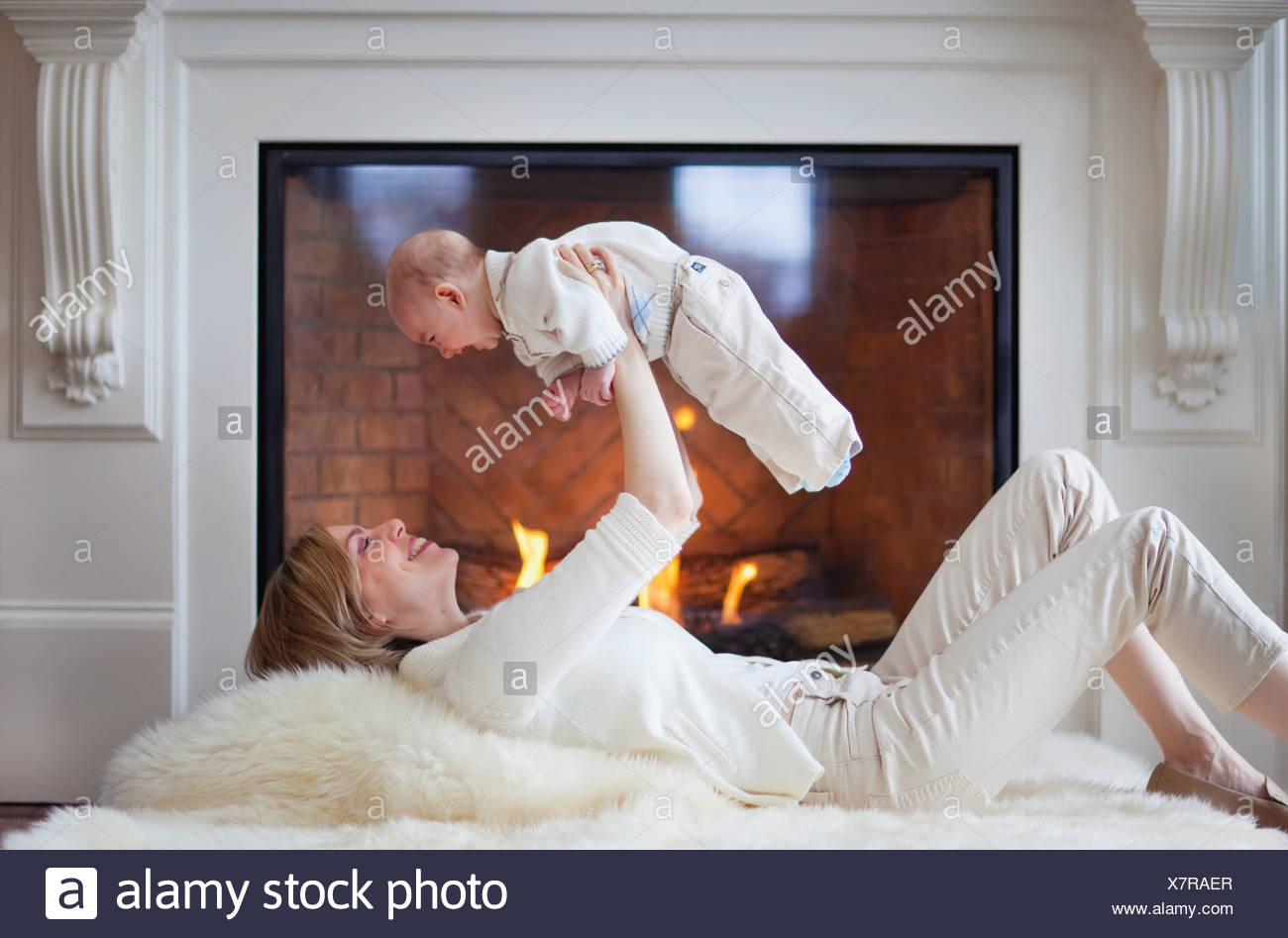 Mother And Baby On Carpet In Front Of Fireplace Jordan