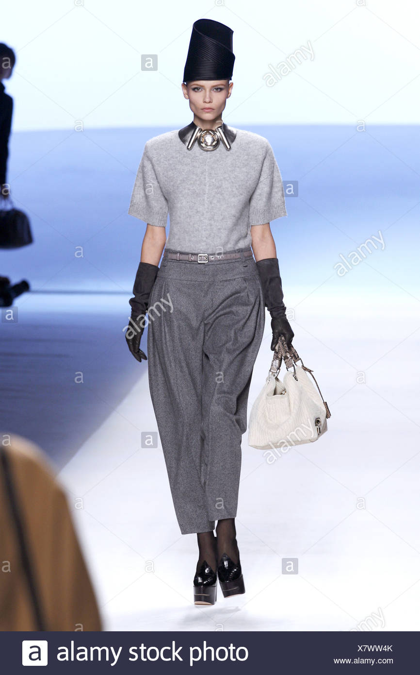 grey trousers black jumper