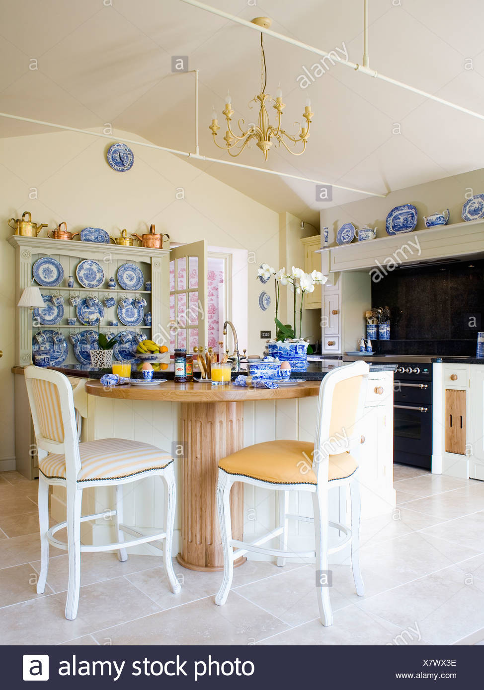 Cream Chairs At Wood Breakfast Bar Set For Breakfast In Cream Country Kitchen Stock Photo Alamy