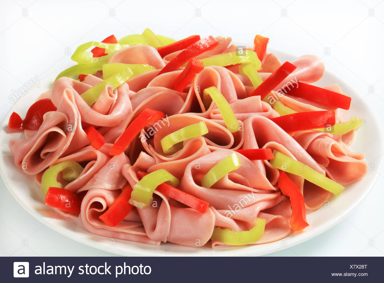 Thinly sliced ham and strips of fresh pepper Stock Photo ...