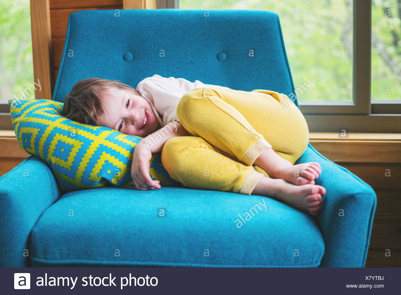 Sleeping Girl Curled Up On Stock Photos & Sleeping Girl Curled Up On