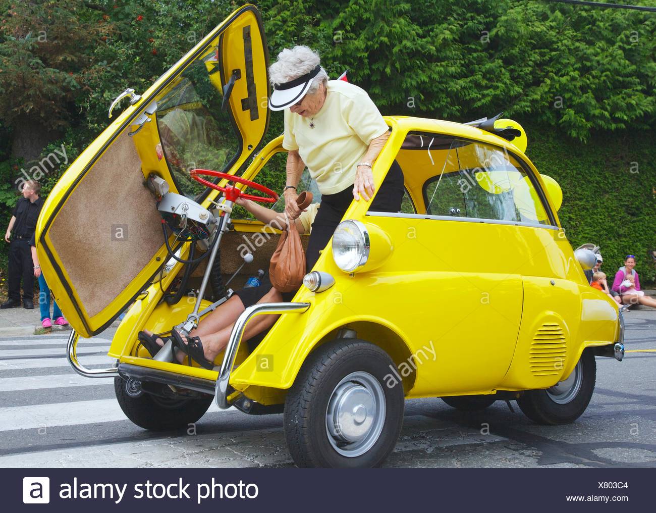 A Bmw Isetta 250 Being Driven In A Parade For The Comox Aquatic Days Festival Has Stopped And Is Showing How A Passenger Gets Stock Photo Alamy