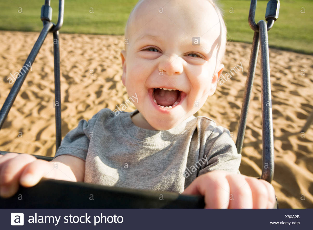 Boy in a swing Stock Photo