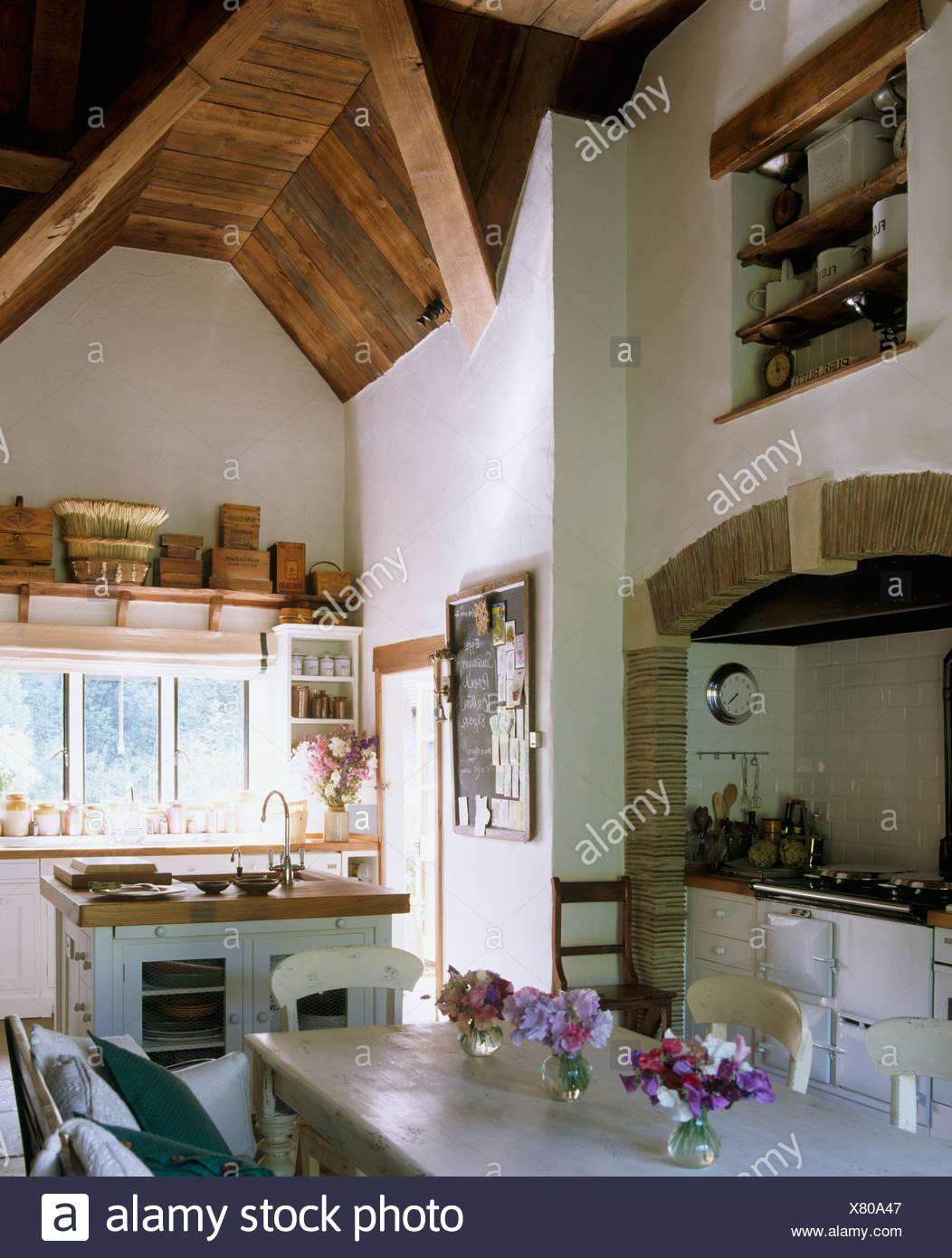 Vases Of Sweet Peas On Painted Table Dining Area Of Large